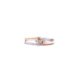 Two-tone ring with a diamond on a white background