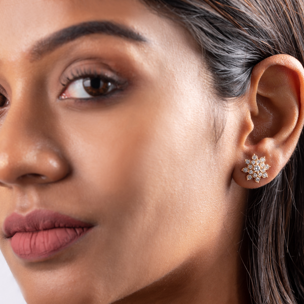 Woman wearing diamond stud earrings hotsell